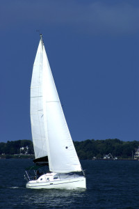 white sails and blue skies