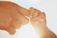 Infant Grasping Mother's Finger